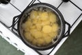 Top view of cooking potato in a pot with boiling water on a gas stove Royalty Free Stock Photo