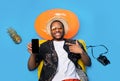 Top view of cool black guy lying on inflatable lilo, pointing at smartphone with blank screen, mockup for mobile app Royalty Free Stock Photo