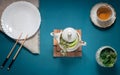 Empty white plate, chopsticks and herbal tea Royalty Free Stock Photo