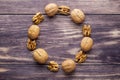 top view copy space peeled and shelled walnuts in the shape of a circle on a wooden background Royalty Free Stock Photo