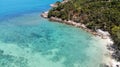 Top view coral bay with blue clear water. White sand beach. Khom beach, Koh Phangan, Thailand.