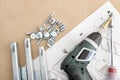 Top view of a cordless screwdriver, drawer sliders, screws and accessories Royalty Free Stock Photo