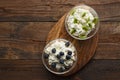 Top view cottage cheese blueberries and kiwis on wooden stand with natural light with copy space