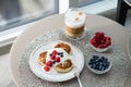 Top view of cottage cheese pancakes with blueberries and raspberries Royalty Free Stock Photo