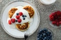 Top view of cottage cheese pancakes with blueberries and raspberries Royalty Free Stock Photo