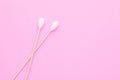 Top view cotton bud for cleaning the ears on pink Royalty Free Stock Photo