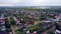 Top view of country town with new house. Clip. New wooden house under construction stands out on background panorama of