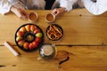 Top view of couple in bathrobes drinking tea with goodies after spa treatments.