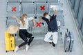 Top view of couple Caucasian lovers man and woman with mask sit on chair with social distancing and show greeting to camera in Royalty Free Stock Photo