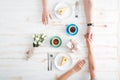 Top view of couple eating dessert and holding hands Royalty Free Stock Photo