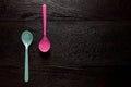 Top view couple plastic spoon on wood table background with copy