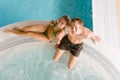 Top view - couple relax in swimming pool