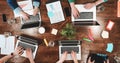 Top view of coworking people sitting together around table. Business meeting of young creative hipsters. Team of analysts make con