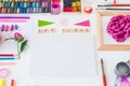 Top view creative artist workplace. Blank Canvas, Art class lettering on wooden blocks and various colorful painting materials and Royalty Free Stock Photo