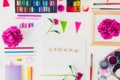 Top view creative artist workplace. Blank canvas with Create word lettering, variety of painting supplies and peony flowers. Royalty Free Stock Photo