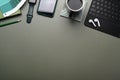 Top view of creative designer workplace with smart watch, mobile phone , wireless keyboard, color swatches and earphone. Royalty Free Stock Photo