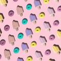 Top view creative layout made of colorful rubber donuts and ice creams on trendy pastel pink background