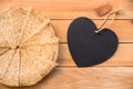 Top view of crepes french pancakes, blank heart with copy space, wood background
