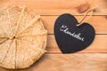 Top view of crepes french pancakes, word chandeleur meaning candlemas written on a heart, rustic wood background Royalty Free Stock Photo