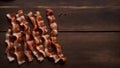 Top View of Crispy Bacon Strips on a Wooden Table, Copy Space