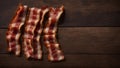 Top View of Crispy Bacon Strips on a Wooden Table, Copy Space