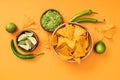 View of crispy Mexican nachos, guacamole