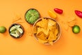 View of crispy Mexican nachos, guacamole