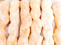 Twist doughnut with sugar on shelf in the bakery shop background.