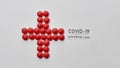 Top view of cross made of red pills and inscription Covid 19 Supportive Care on light background. Medications, virus and