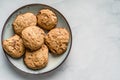 Top view of crunchy oatmeal chip cookies fresh baked biscuits with chocolate and cocoa in a plate on the table homemade food Royalty Free Stock Photo