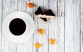 top view crunchy waffle cake on the left with cup of coffee kumquat and copy space on white wooden background