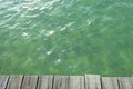 The top view of crystal clear sea water scenery seen from the wooden bridge