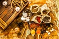Top view of culinary seasonings & herbs, hot red chilli, white pepper, dried chilli powder in spoons, garlic, spices in sacks, ci Royalty Free Stock Photo