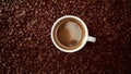 Top view of cup of black coffe put it on coffe beans background Royalty Free Stock Photo