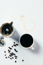 top view of cup of black coffee with mocha pot on messy Royalty Free Stock Photo