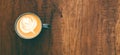 Top view cup of cappuccino on wooden table with beautiful latte art. Copy space Royalty Free Stock Photo