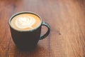 Top view cup of cappuccino on wooden table with beautiful latte art. Copy space Royalty Free Stock Photo