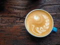 Top view of a cup of cappucino on a wooden background Royalty Free Stock Photo