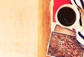 Top view of cup of coffe and stack of photos filtered image travel or vacation concept