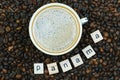 Top view of a cup of coffee on a background coffee beans with the inscription Panama. Country of coffee production