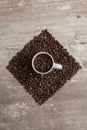 Top view of a cup with coffee beans, square shape Royalty Free Stock Photo