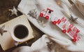 Coffee, book, Merry Christmas train and decorations on a wooden background Royalty Free Stock Photo