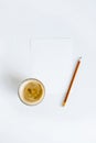 top view of cup of coffee on white paper with pencil Royalty Free Stock Photo