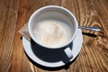 Top view of a cup of drunk delicious cappuccino on the table.