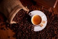 Top view of cup of espresso with coffee beans and old grinder Royalty Free Stock Photo