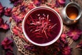 top view of a cup of hibiscus tea with dried petals scattered around Royalty Free Stock Photo