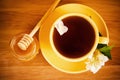 The top view on a cup of tea with a flower and honey Royalty Free Stock Photo