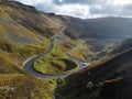 Top view of curvy Bwlch-y-Clawdd Road surrounded by valley on a sunny day, Treorchy, Wales