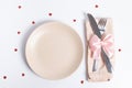 Top view cutlery and empty plate on the table. Serving for a romantic dinner on valentines day concept