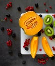 top view cutting board with fresh fruit on dark